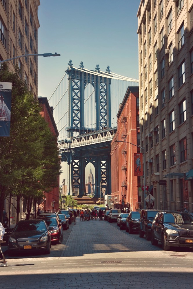 The Manhattan Bridge framed between buildings in DUMBO, Brooklyn